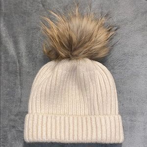 Hat with fur puff